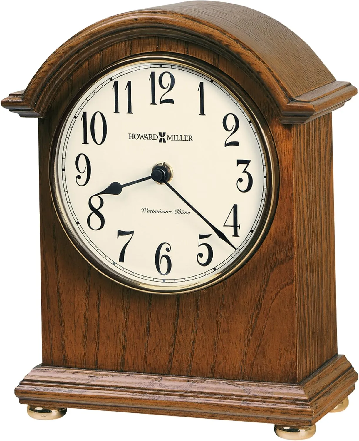 Howard Miller Myra Mantel Clock - Quartz Movement Battery Operated Analog Table Clock with Westminster Chime, Arch Style, White Dial, Brown Wooden Finish for Home Living Room Decor and Shelf Display